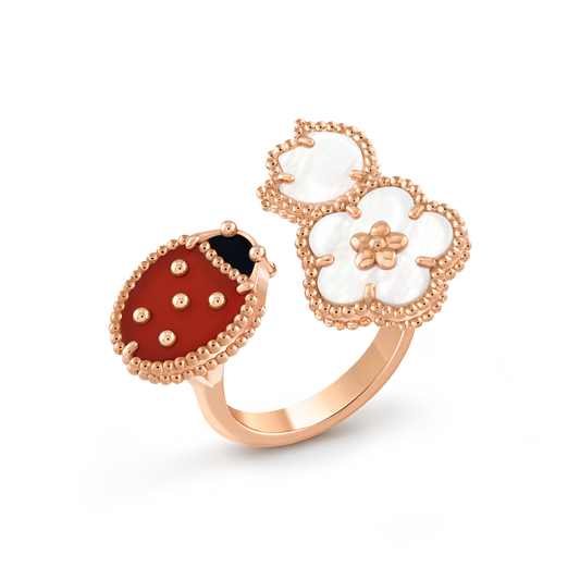 Lucky Spring Between the Finger ring, 18K rose gold, white mother-of-pearl, carnelian, onyx.