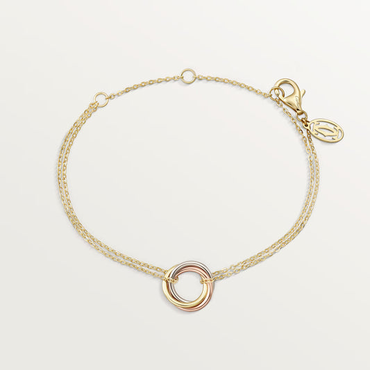 Trinity bracelet 18K white gold, rose gold and yellow gold on chain.