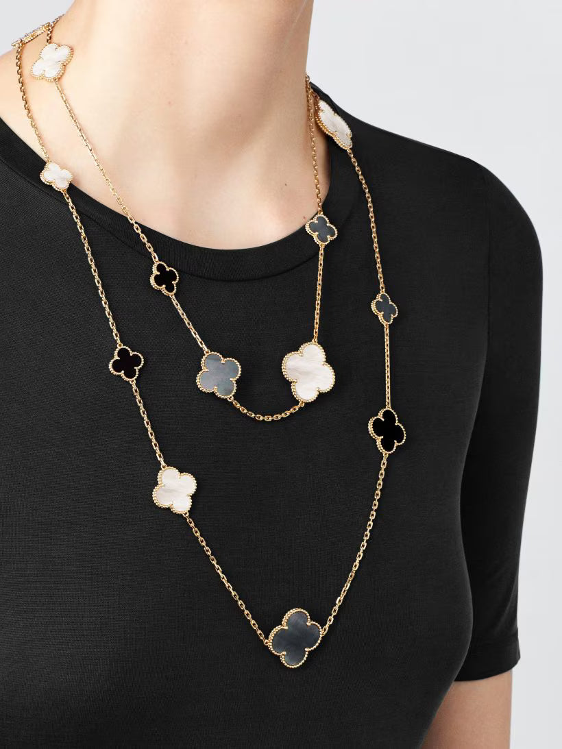Magic Alhambra long necklace, 16 motifs, 18K yellow gold, white and gray mother-of-pearl, onyx.