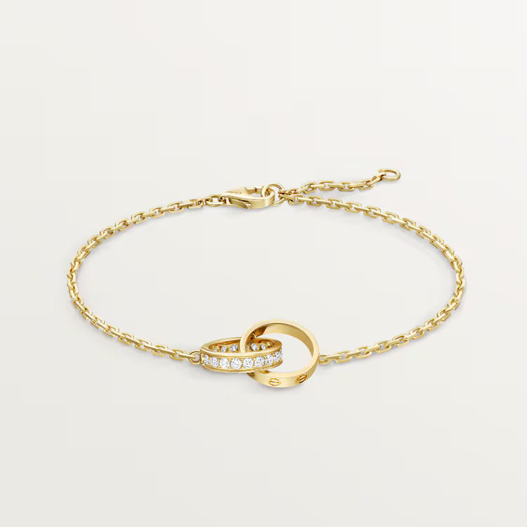 LOVE bracelet, on chain, half-paved. 18k GOLD