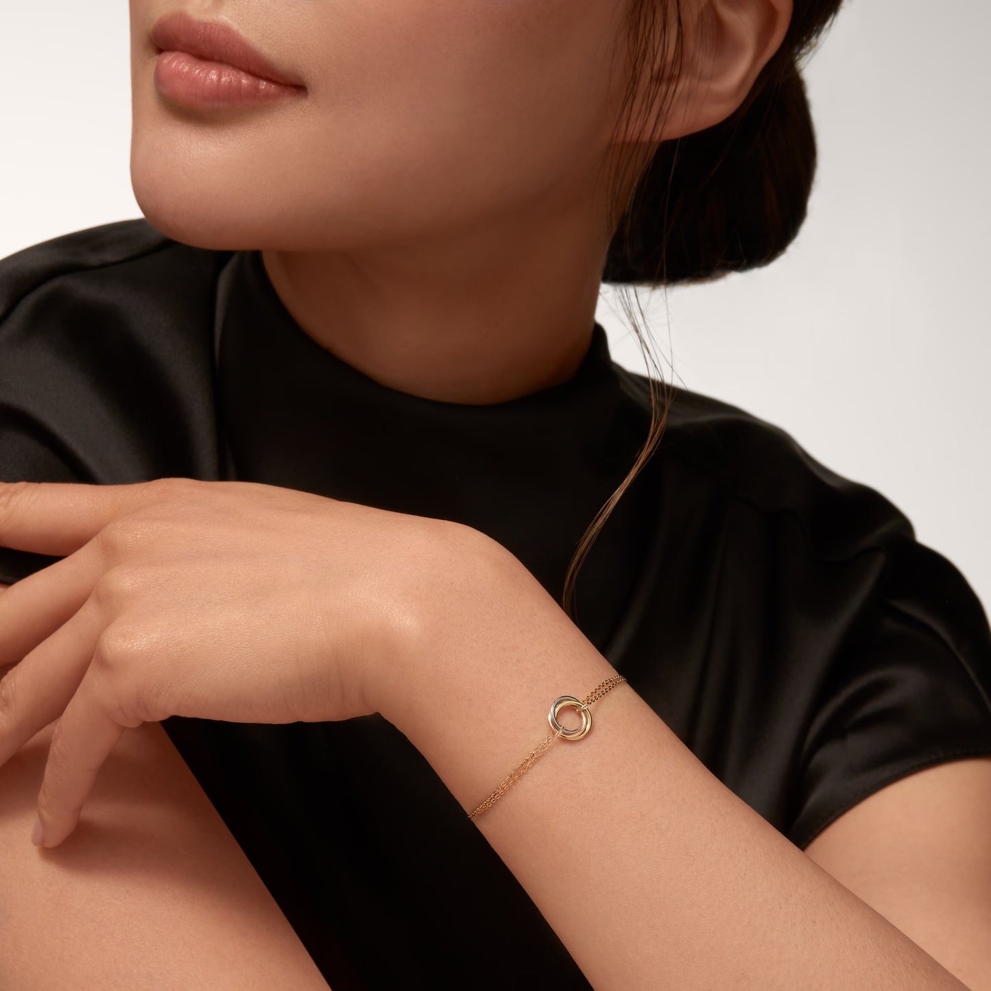 Trinity bracelet 18K white gold, rose gold and yellow gold on chain.