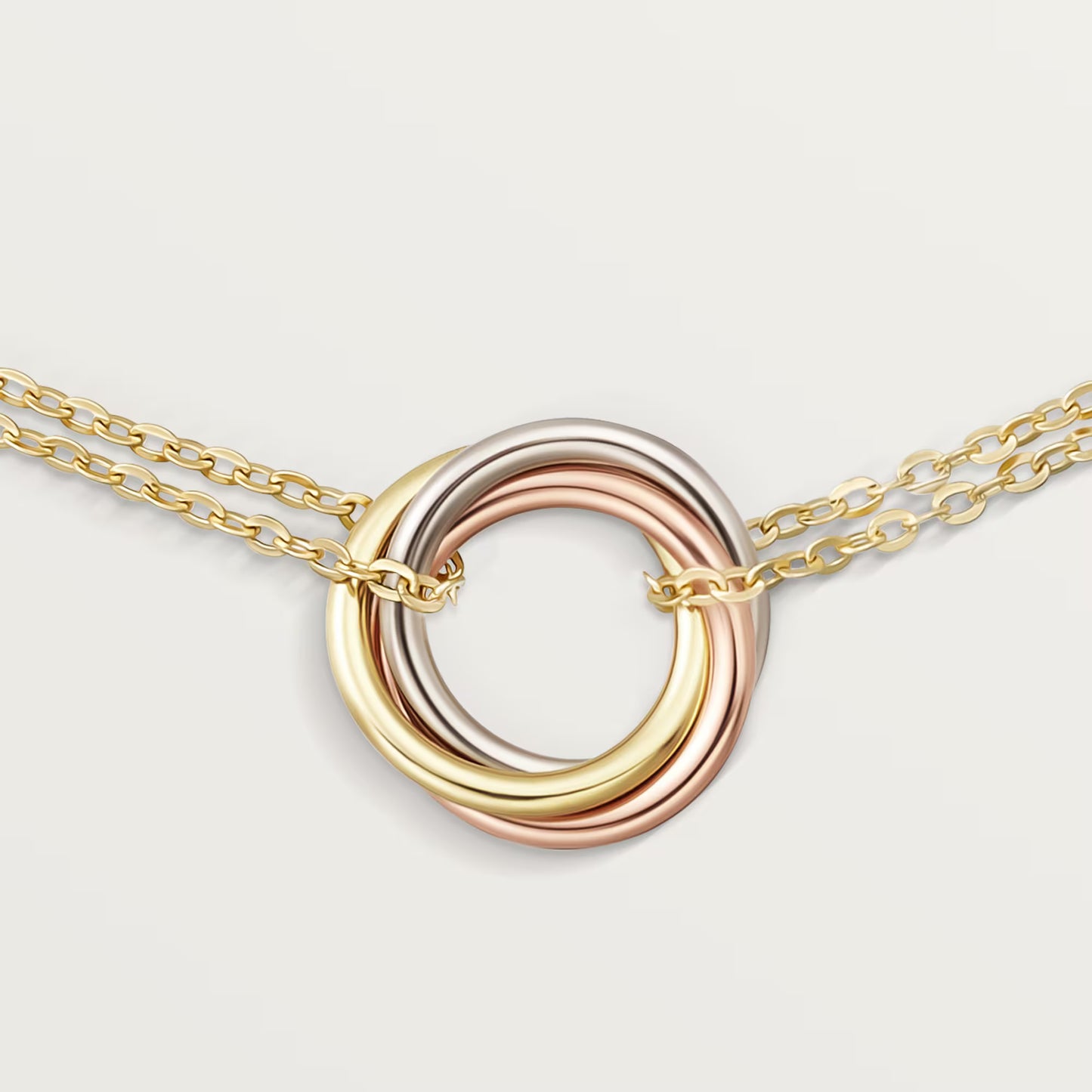 Trinity bracelet 18K white gold, rose gold and yellow gold on chain.