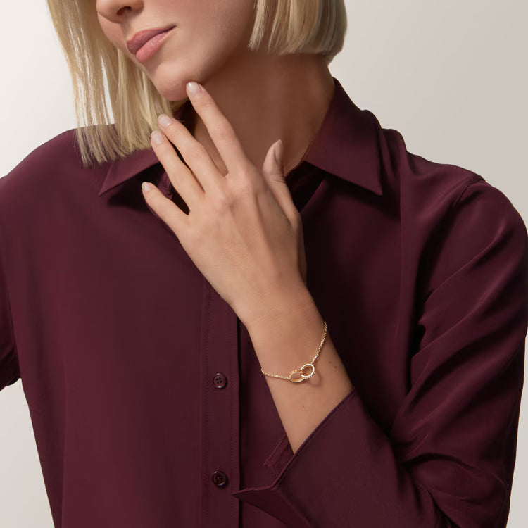 LOVE bracelet, on chain, half-paved. 18k GOLD