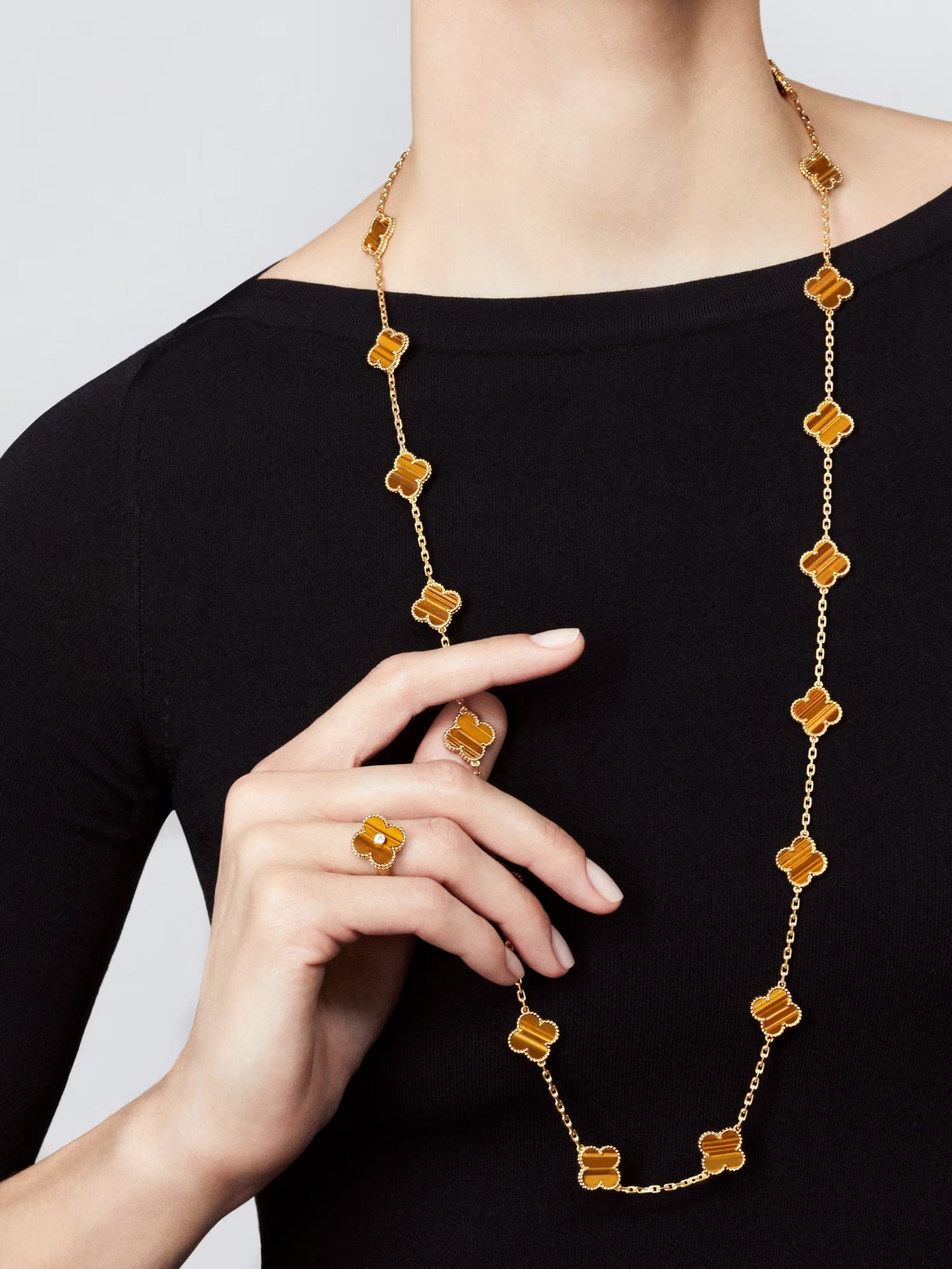 Vintage Alhambra long necklace, 20 motifs, 18K yellow gold, tiger’s eye.