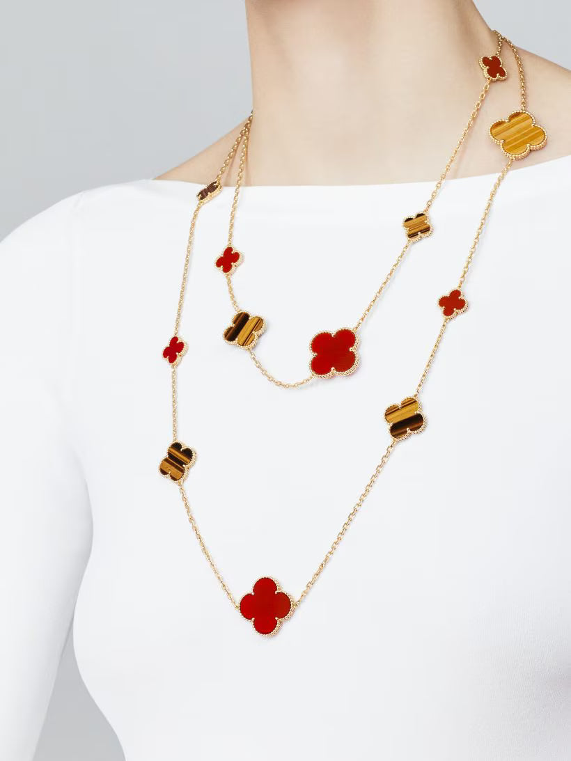 Magic Alhambra long necklace, 16 motifs, 18K yellow gold, carnelian, tiger’s eye.