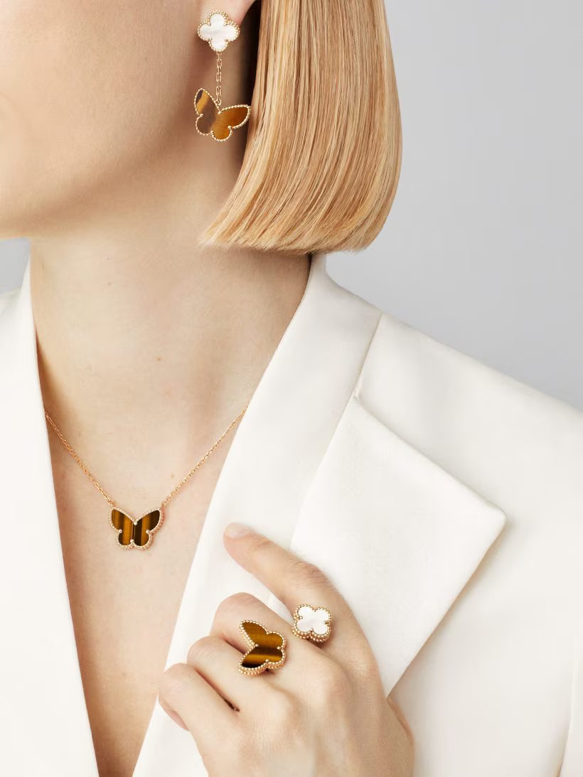 Lucky Alhambra butterfly pendant, 18K yellow gold, tiger’s eye.