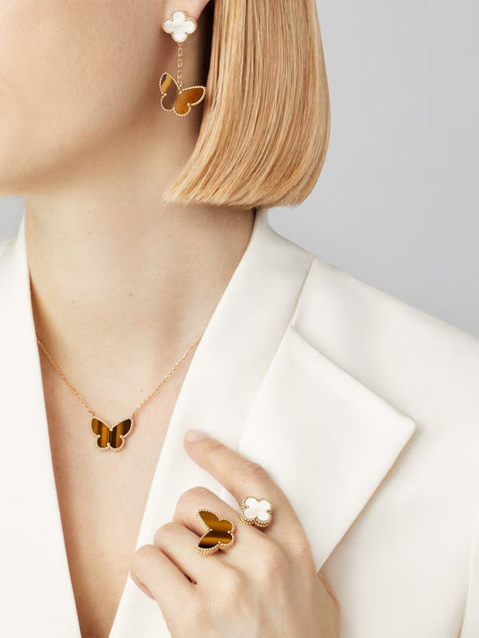 Lucky Alhambra butterfly pendant, 18K yellow gold, tiger’s eye.