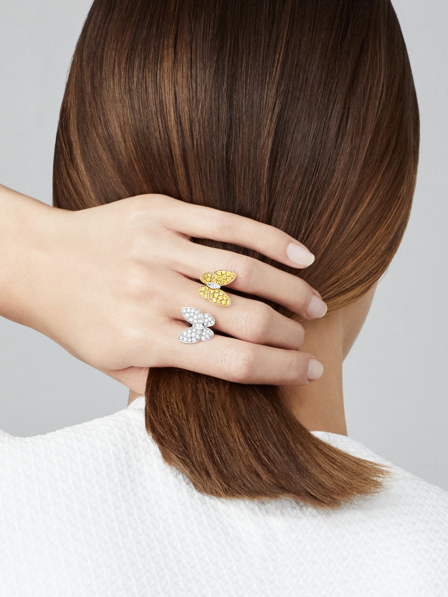 Two Butterfly Between the Finger ring, 18K yellow and whitw gold, rhodium plated, round and marquise-cut diamonds.