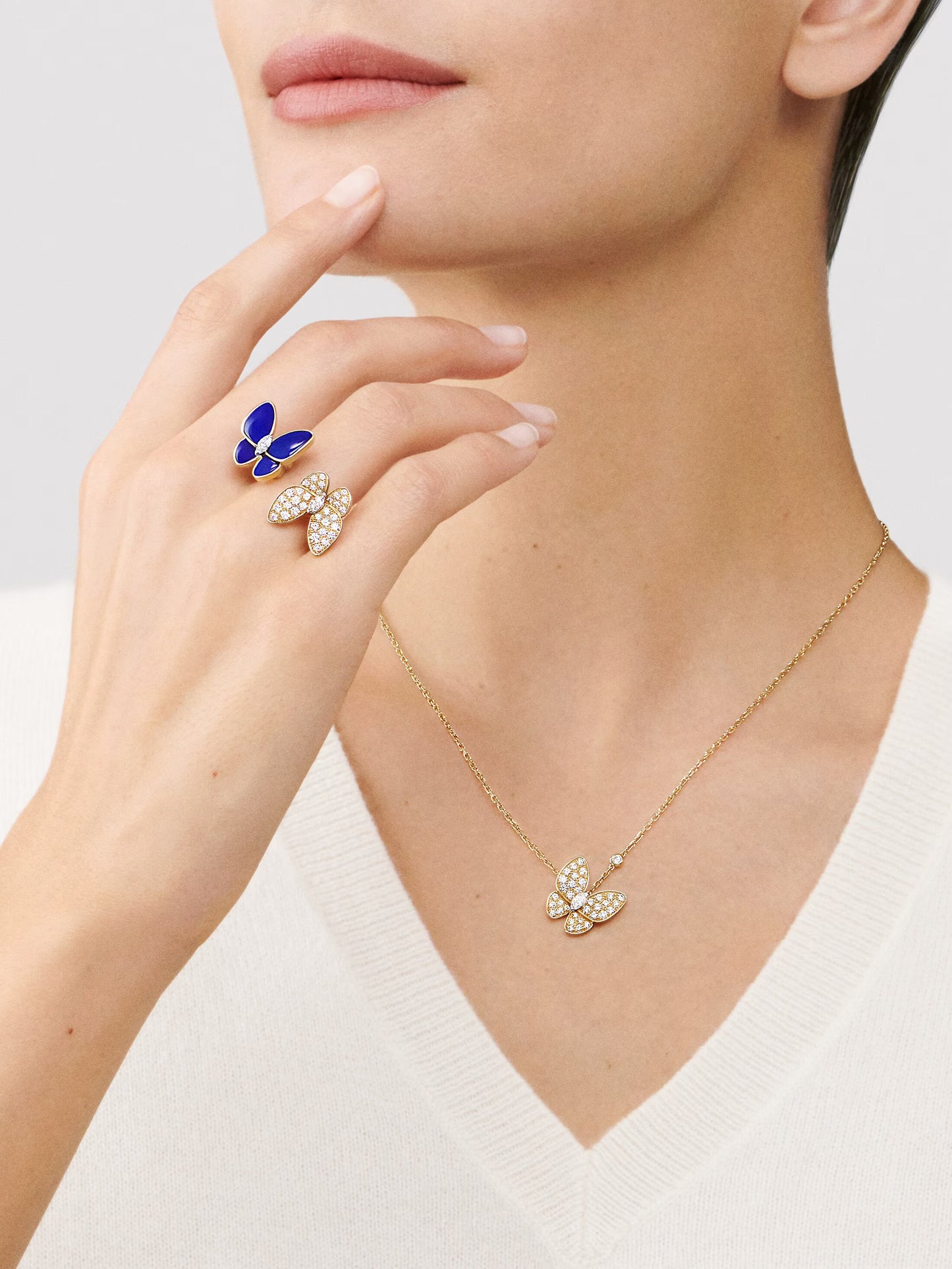 Two Butterfly pendant, 18K yellow gold, round diamonds, rhodium plated 18K white gold, marquise-cut diamonds.