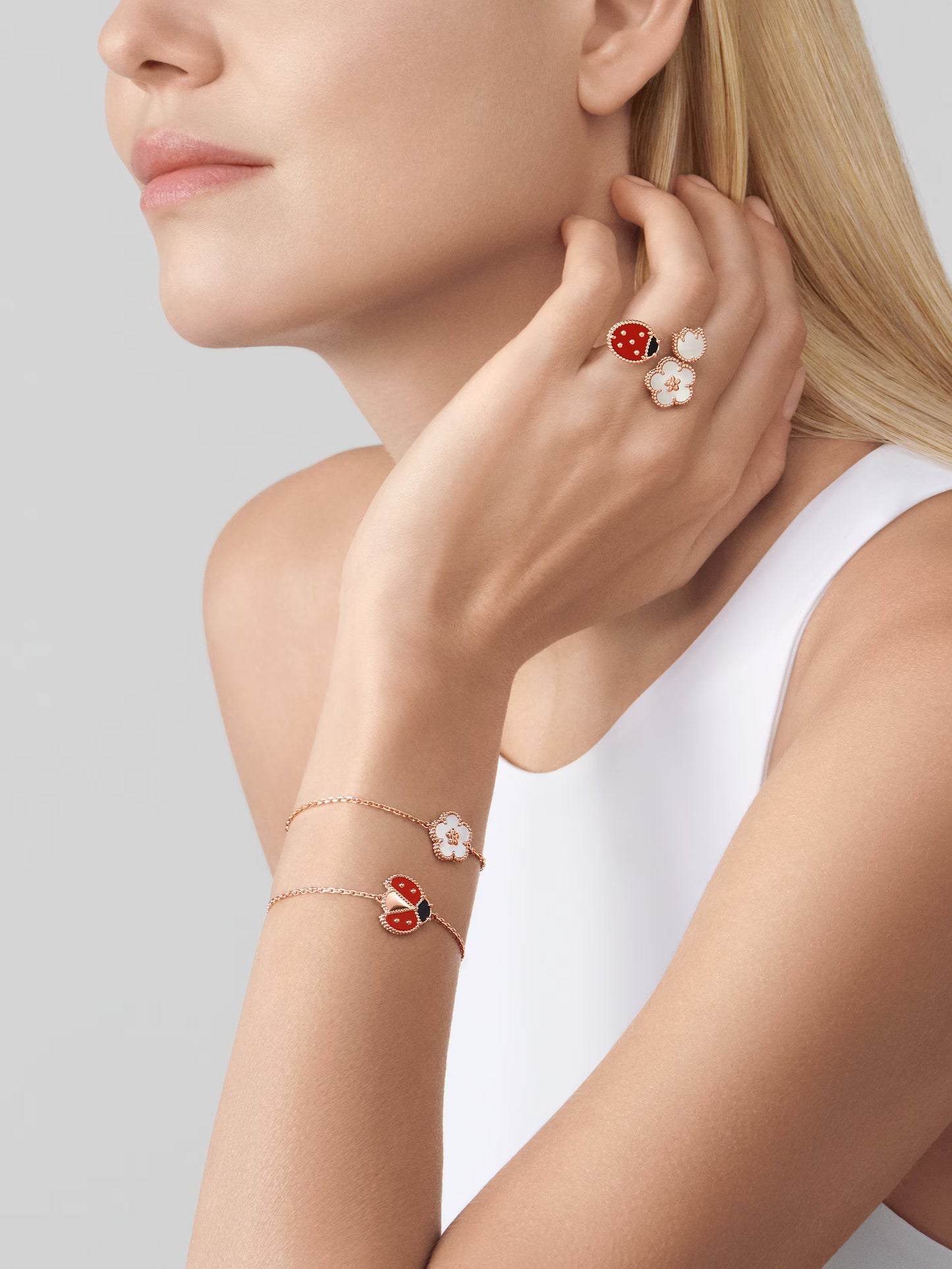 Lucky Spring Between the Finger ring, 18K rose gold, white mother-of-pearl, carnelian, onyx.