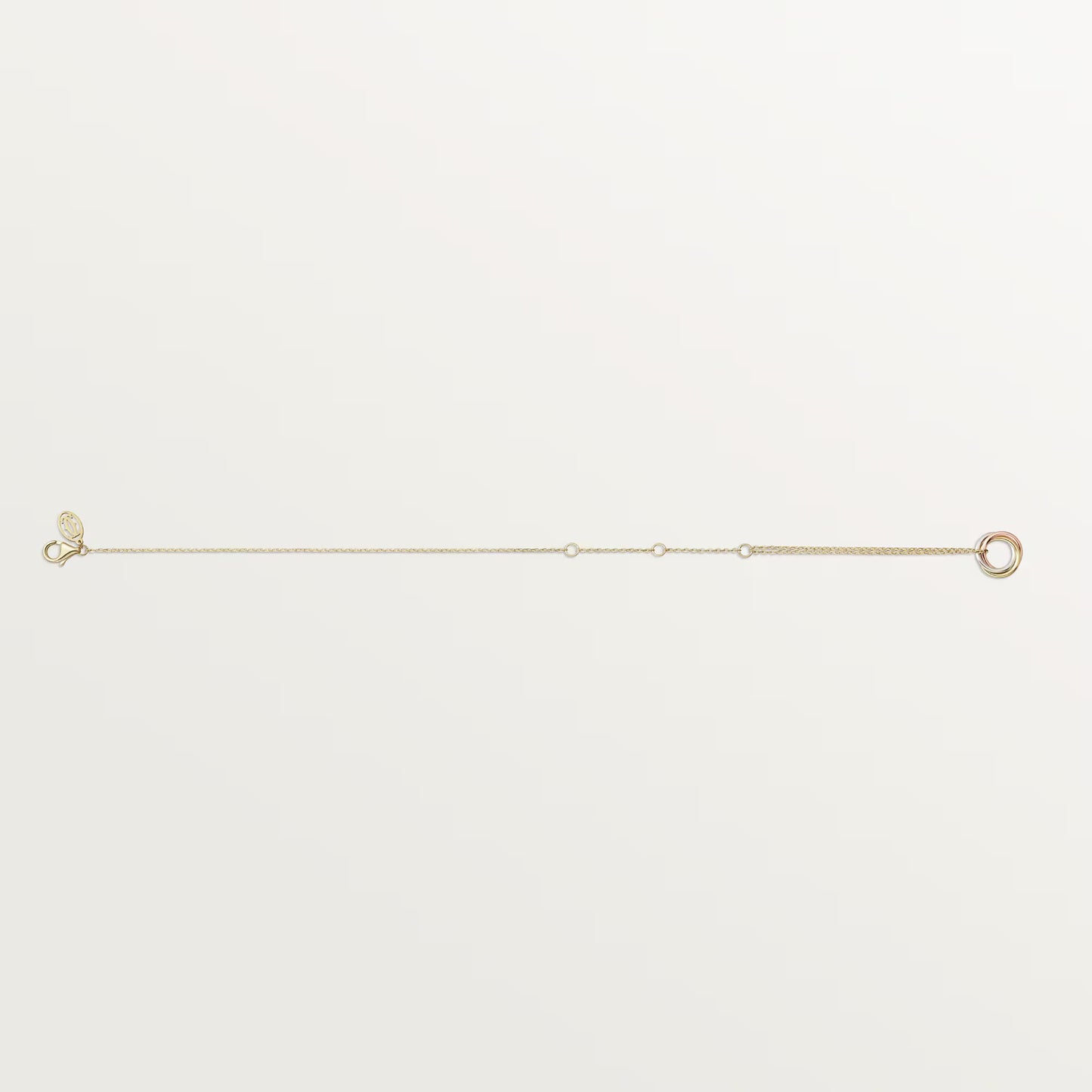 Trinity bracelet 18K white gold, rose gold and yellow gold on chain.