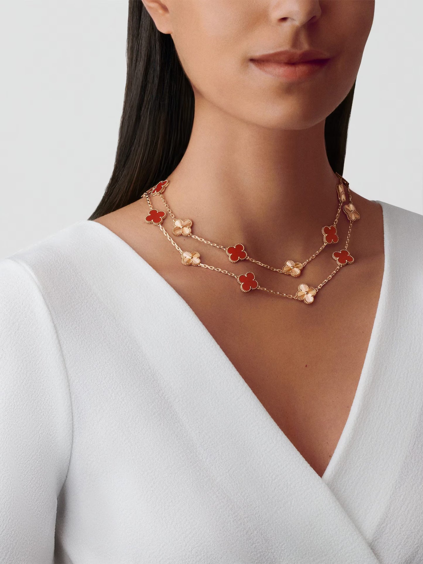 Vintage Alhambra long necklace, 20 motifs, guilloché 18K rose gold, carnelian.