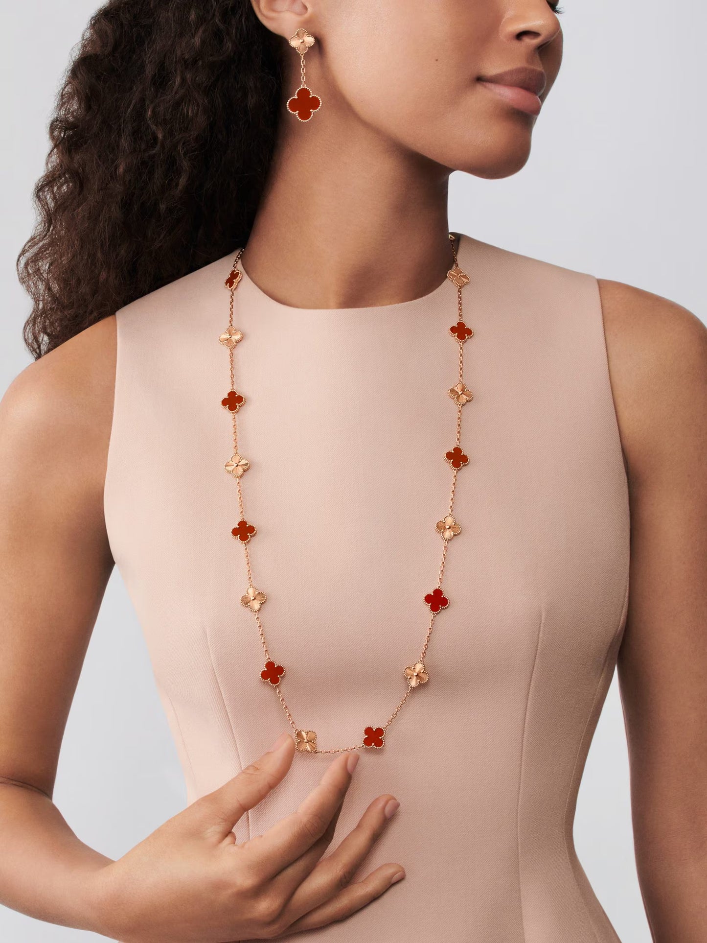 Vintage Alhambra long necklace, 20 motifs, guilloché 18K rose gold, carnelian.